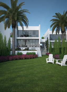 Back view modern two storey villa. Garden view with lawn area and palmtrees